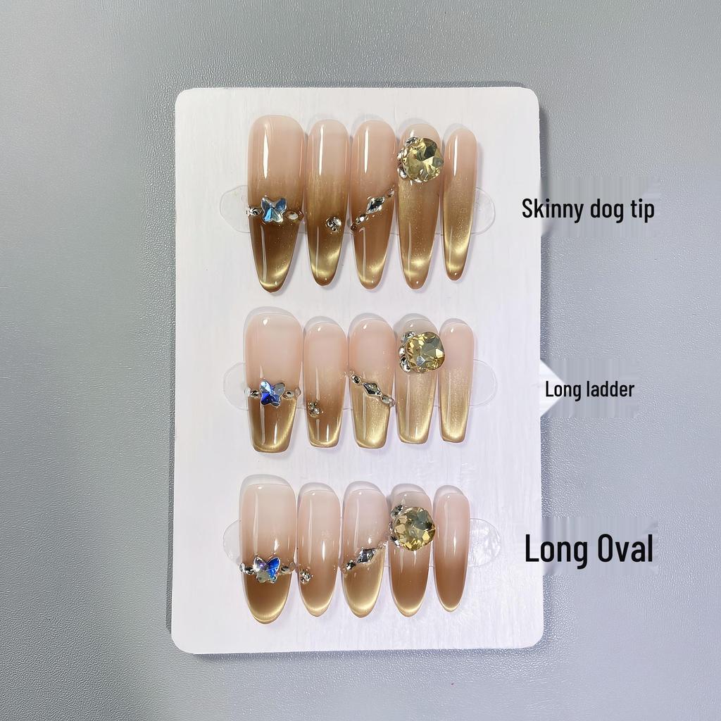 Gemstone Diamond Press-On Nails: Luxurious Gold Nude Gradient with Cat Eye and Whitening Effect.