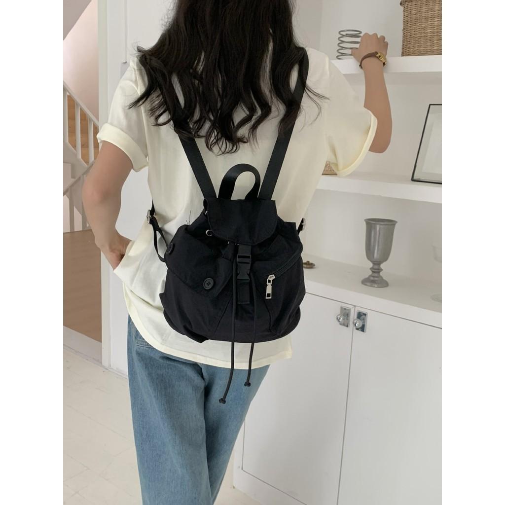 IELGY new Korean niche design outdoor pocket button drawstring double shoulder nylon backpack
