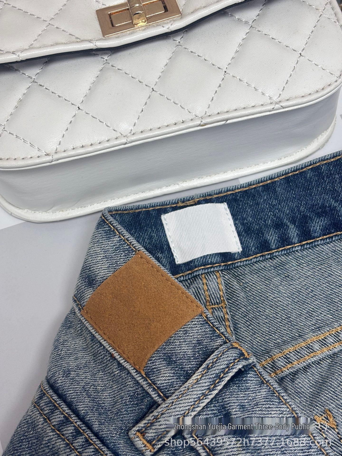 High-Waisted Retro Blue Denim with Four-Leaf Clover Embroidery for Women L