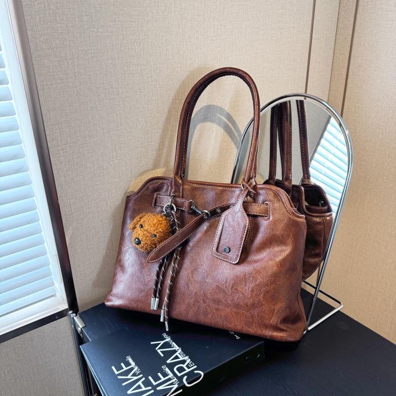 

2024 autumn new casual shoulder bag niche tote bag underarm bag casual fashion simple sense portable women s bag коричневий