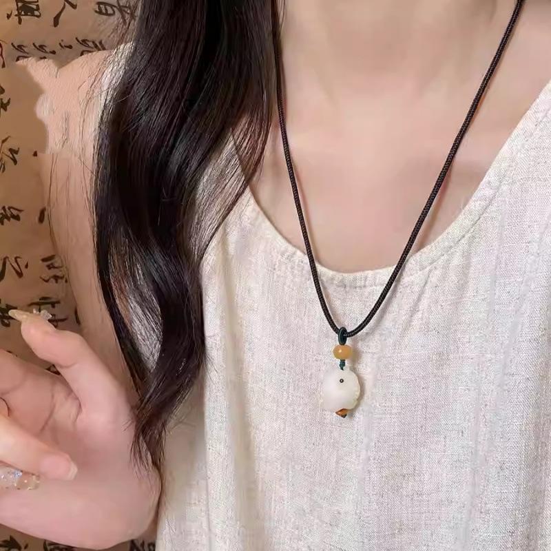 

Zen-inspired white jade bodhi lotus pendant necklace for women, new Chinese-style vintage ethnic braided long sweater chain accessory Bodhi fish necklace