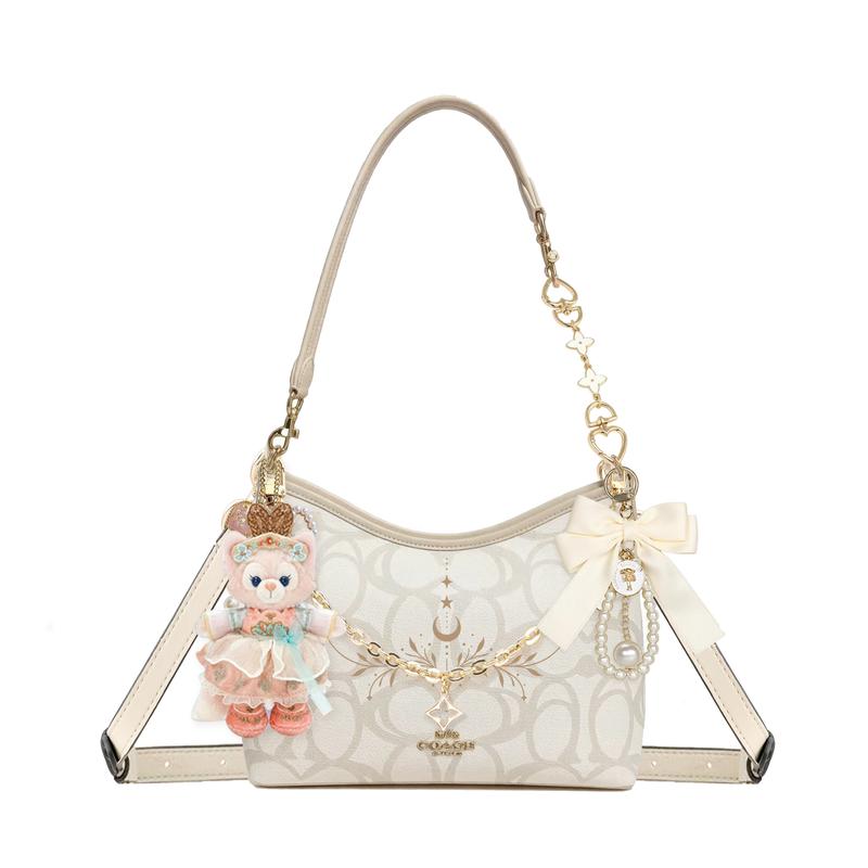 

COACH shoulder bag [Customized bag] Laurel Signature 31 brand print gold accessories doll bow pearl chain coated Listen to the Wind Sing Basic Model золотий