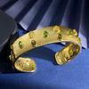 Brushed Gold-Plated C-Shaped Bracelet with Oval Gem