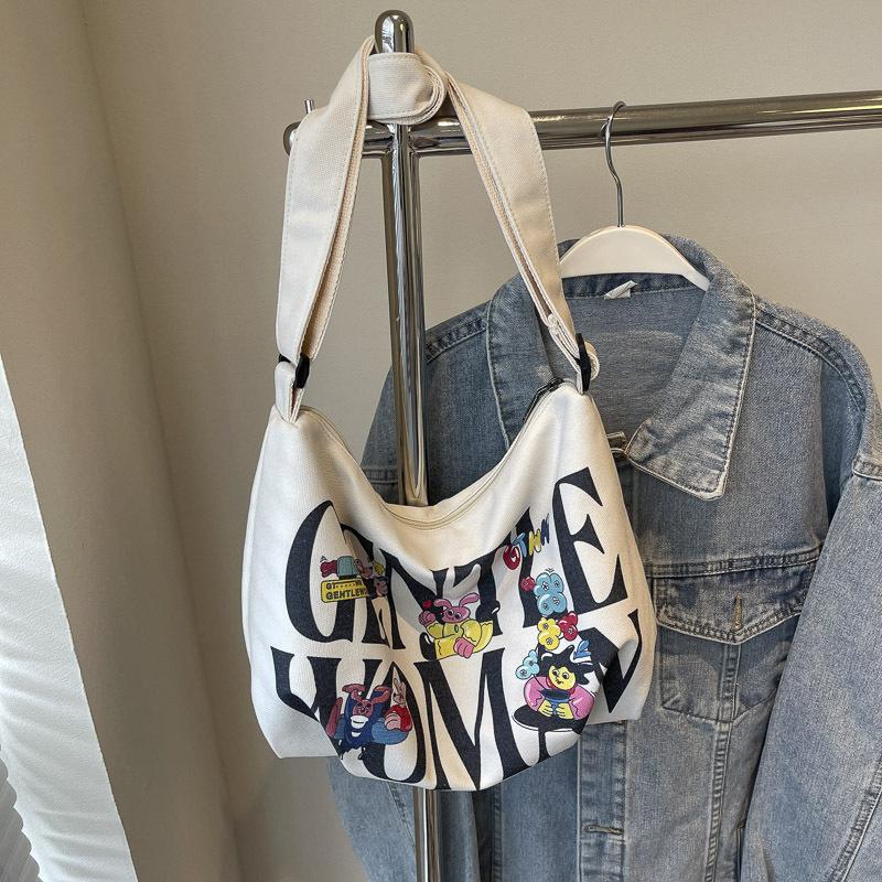 Alphabet canvas bag women's large capacity 2025 new casual handheld cloth bag student class shoulder bag leisure bag