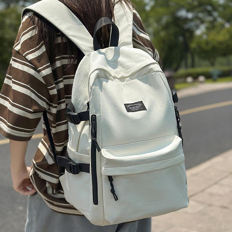 Couple backpack large capacity anti-splashing fashion backpack casual junior high school college student schoolbag high value