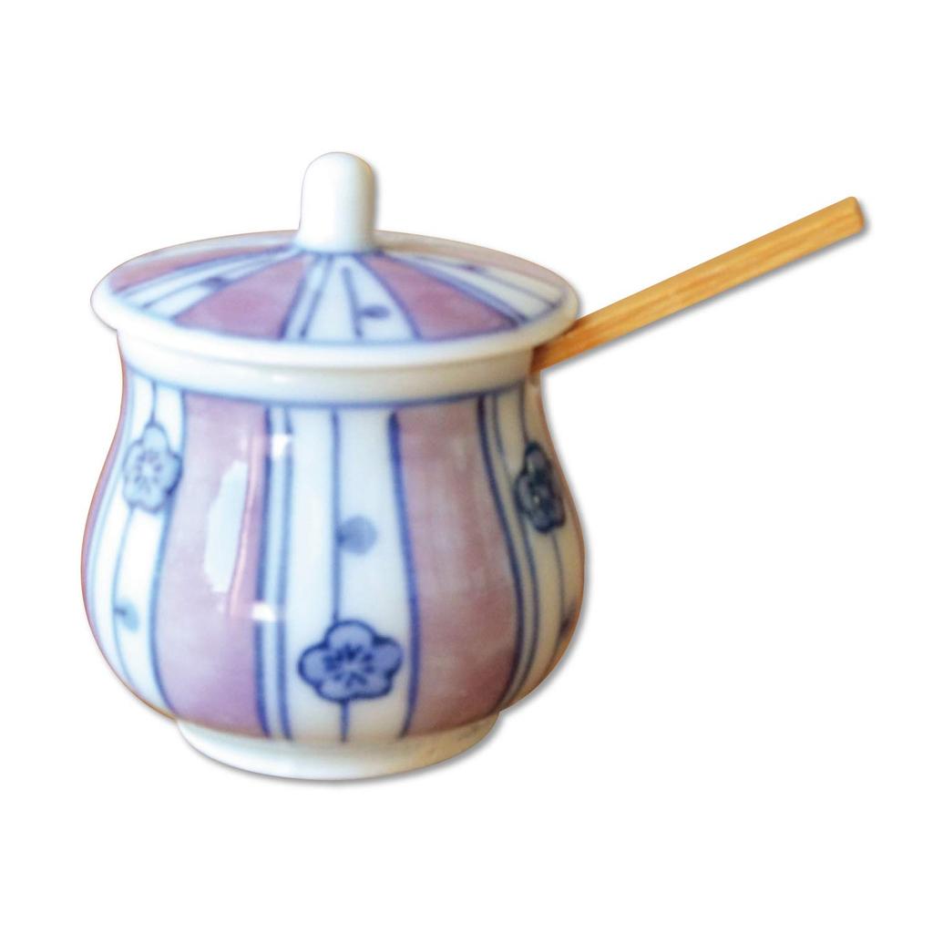 Stylish ceramic condiment container with lid and bamboo perfect for home or commercial Made in Japan by Arita featuring a chestnut plum spoon, use.