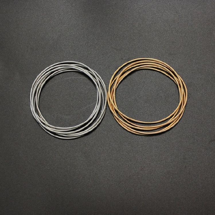 Infällbar Armband Kolstål Trådarmband Smycken Fjäderarmband Spolset