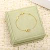 Exquisite Gold-Plated Copper Bracelet with Diamond-Studded Three-Leaf Clover Design