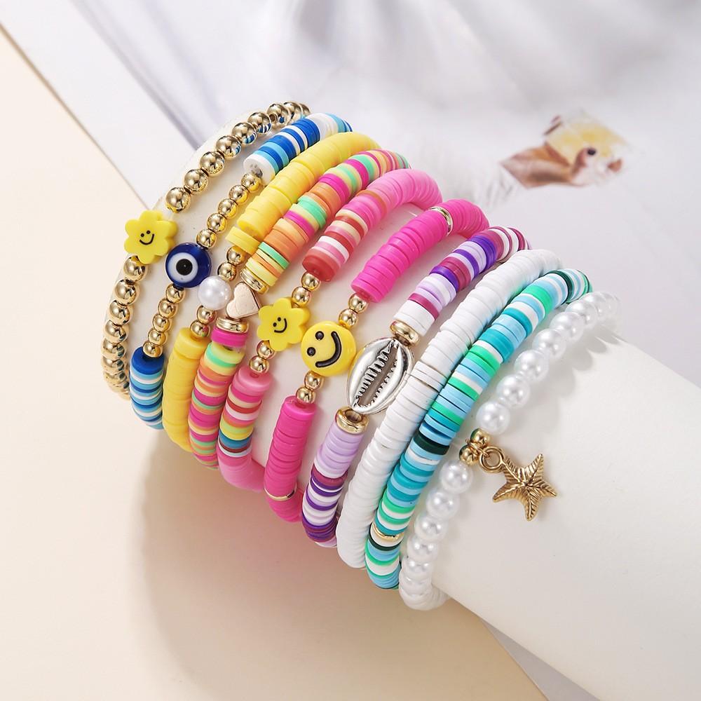 Korean version of fashion new multi-layer elastic thread soft pottery love smiley face bracelet set retro handmade pearl jewelry women