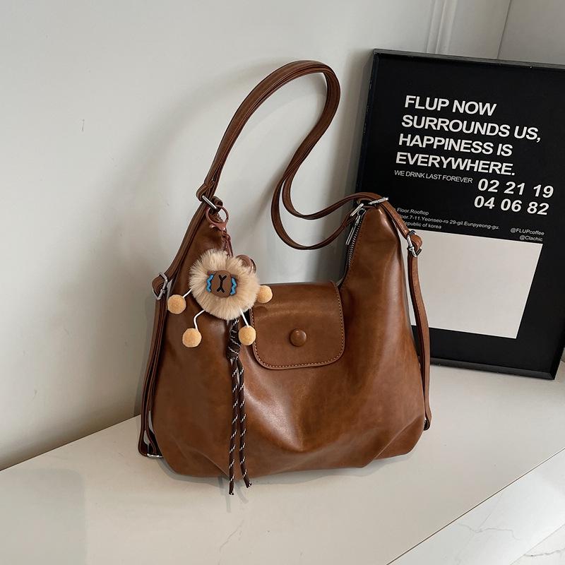 Nische Retro 2025 Damen Schulter-Crossbody-Tasche mit großem Fassungsvermögen und Anhänger