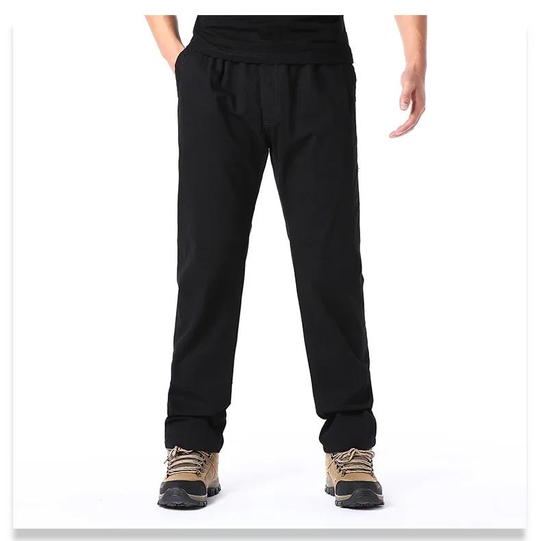 Wiosenne jesienne modne spodnie casualowe dla mężczyzn bawełniane spodnie cargo w jednolitym kolorze z elastyczną talią proste nogawki streetwear męskie spodnie joggers