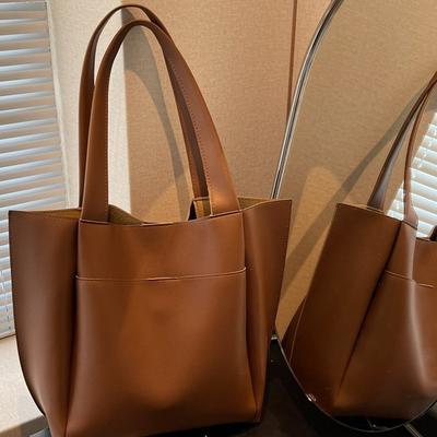 Lente nieuwe tote bag modieuze grote capaciteit bucket bag eenvoudige dames woon-werkverkeer oksel schoudertas