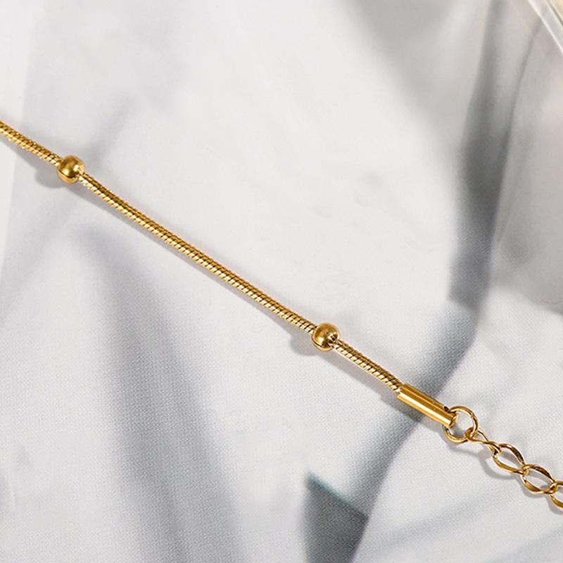 Gold-Tone Titanium Steel Snake Chain Bracelet with Beads - Non-fading, Simple Design for Women.