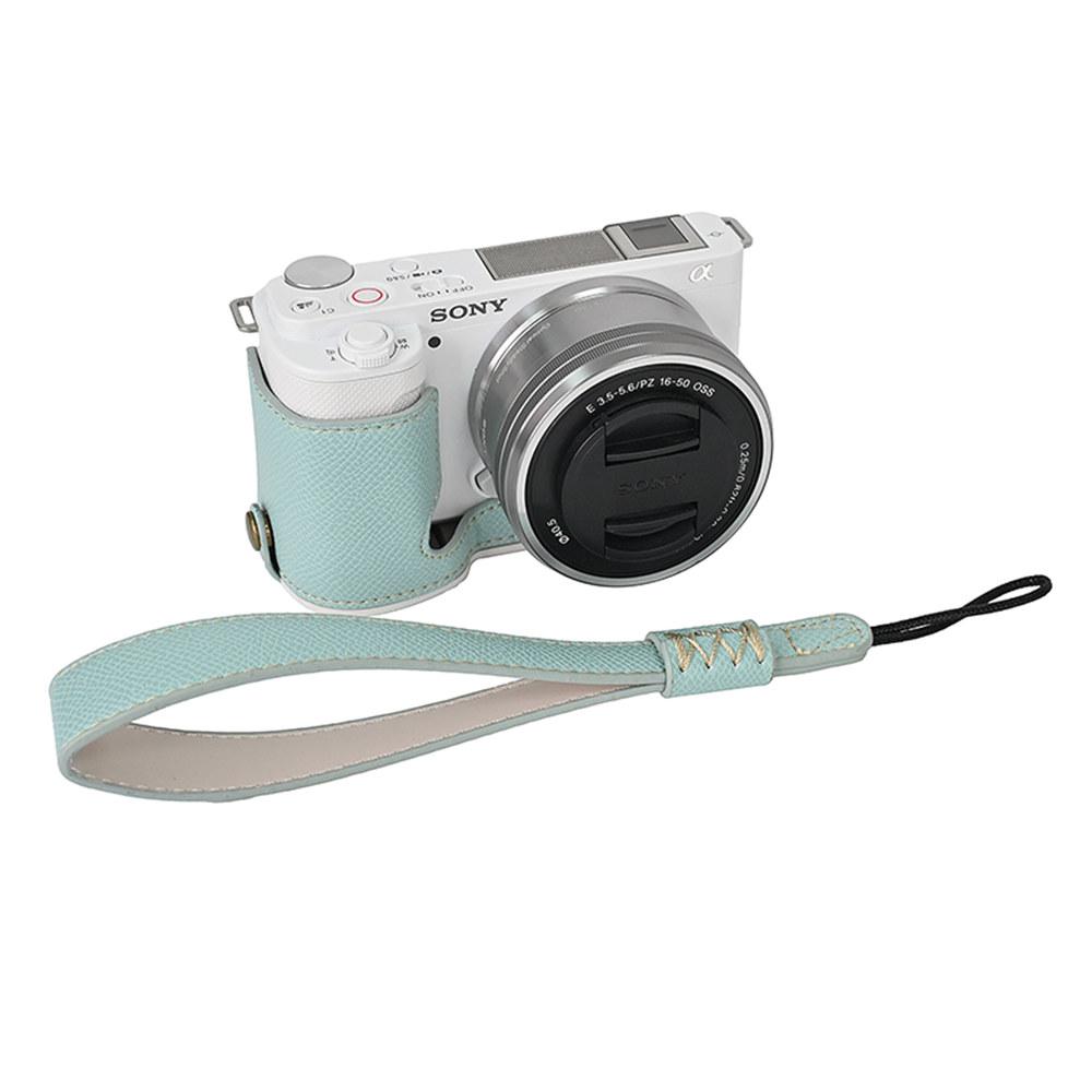 Kamera-Halbhülle aus PU-Leder mit Palmenmuster für Sony ZVE10 ZV-E10, Batterieöffnung mit Handschlaufe