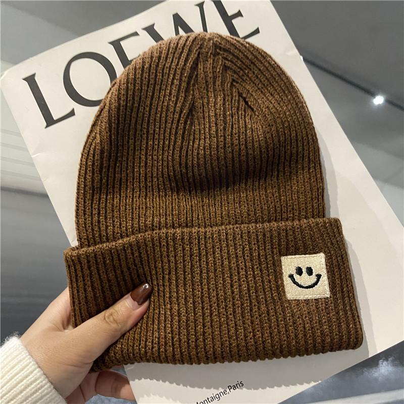 Cute smiley face label wool hat women's autumn and winter warm trend versatile ear protector black knitted hat men