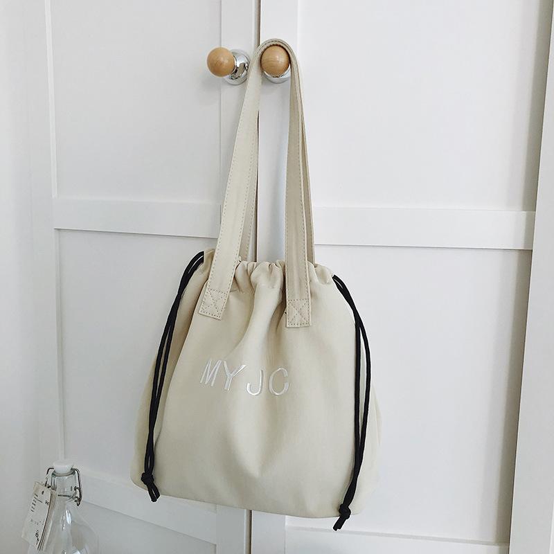 Large-capacity bag women's new summer versatile shoulder bag drawstring lazy wind college student class bag