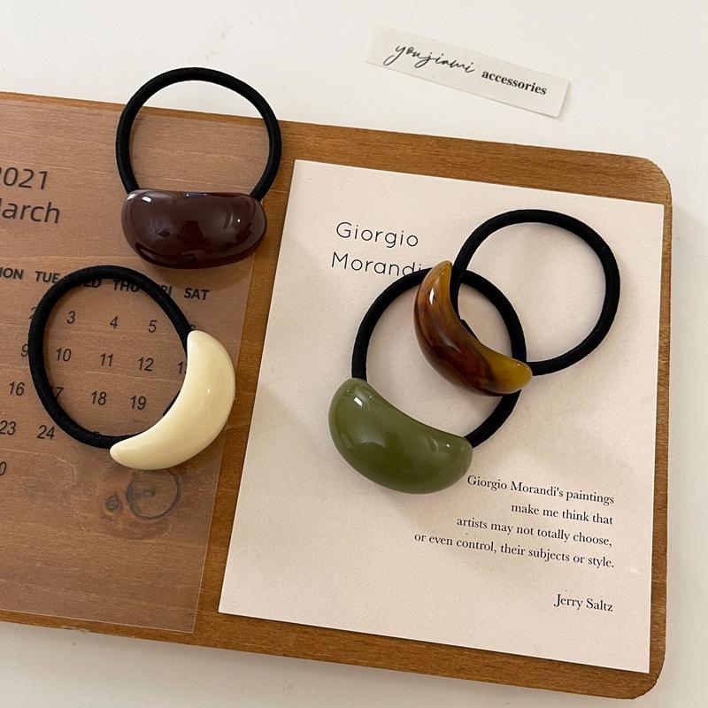 Ein schlichter und eleganter, kalter Stil Acryl-Bogenförmiger Lederband-Kopfschmuck für Damen