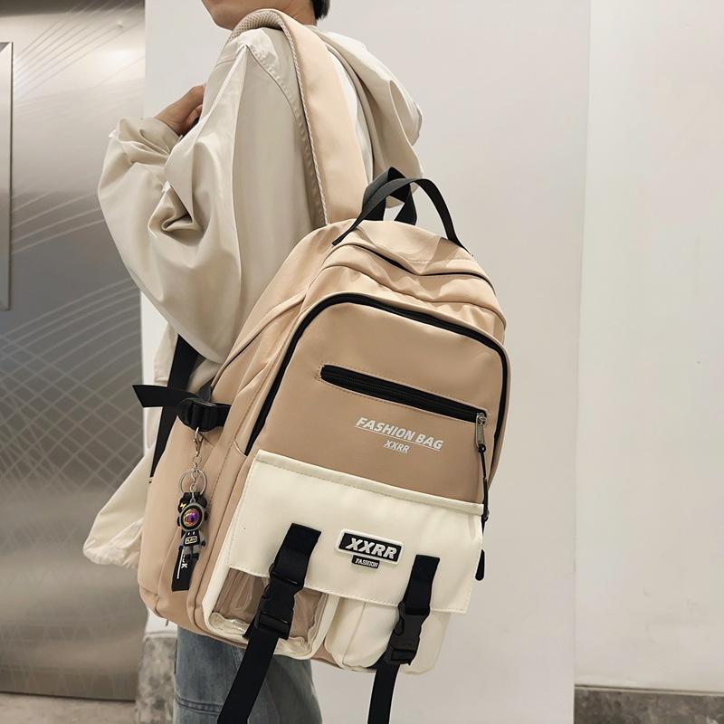 

Student schoolbag, female alphabet color matching backpack, spring large-capacity male and female models, junior high school backpack