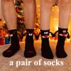 A pair of socks Fabric Christmas Socks - 3D Eyes Magnetic Cartoon Design, Hand-in-Hand Mid-Calf Playful Holiday Gift
