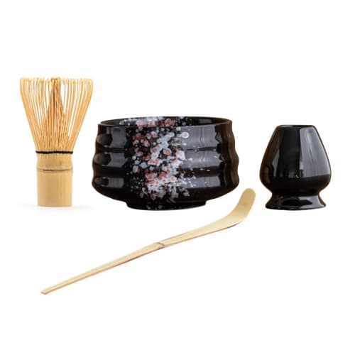 This 4-piece tea ceremony set includes a tea whisk, a 100-piece tea whisk holder, a straightening tool, a tea scoop, and a matcha bowl. It's compact a