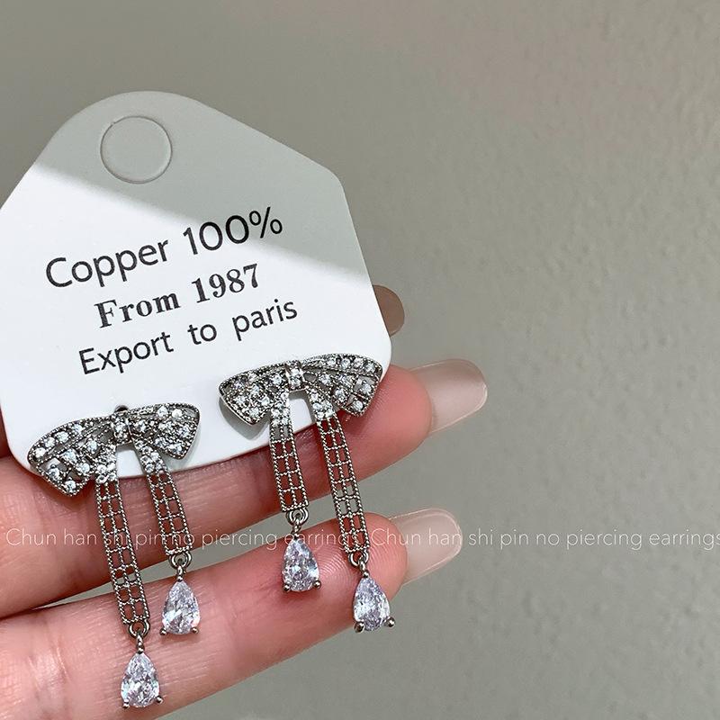 

No pierced earrings, sweet bow, slightly inlaid zircon stud earrings, light luxury, high-end earrings, design, niche earrings.