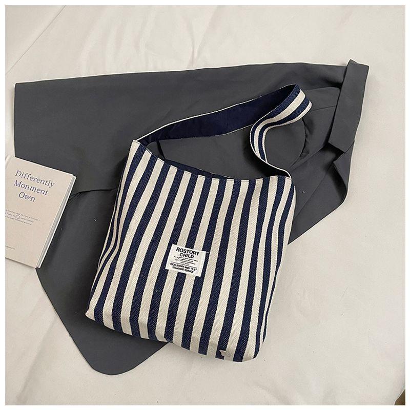 

South korea Niche Stripe Shoulder Bag Women 2025 New Casual Large Capacity Tote Bag Spring Versatile Canvas Bag Blue [Collection plus purchase priority delivery]]
