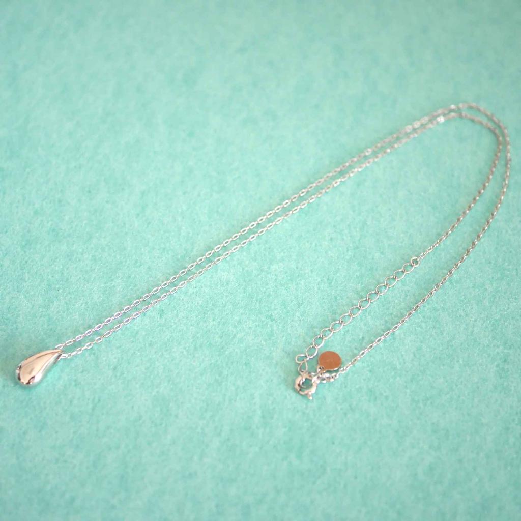 This Genuine 925 Sterling Silver 18K Teardrop Charm Necklace Features a Minimalist Design and a Small It Comes with a Drawstring Pouch and Is a