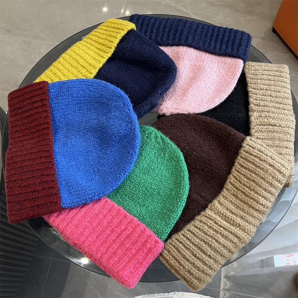 Simple two-color splicing wool hat women's autumn and winter warm niche versatile ear protection hat large version knitted pullover hat tide