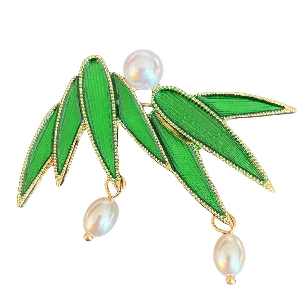 

Брошка Ювілейна Роса на Бамбуковому Листі: Дизайн синього пір я павича в китайському стилі