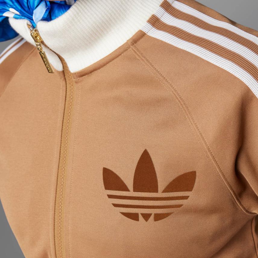 Adidas Jachetă Sport lungă Originals Clover Tracktop, cu imprimeu cu logo în dungi Jachete pentru femei Maro IB2064