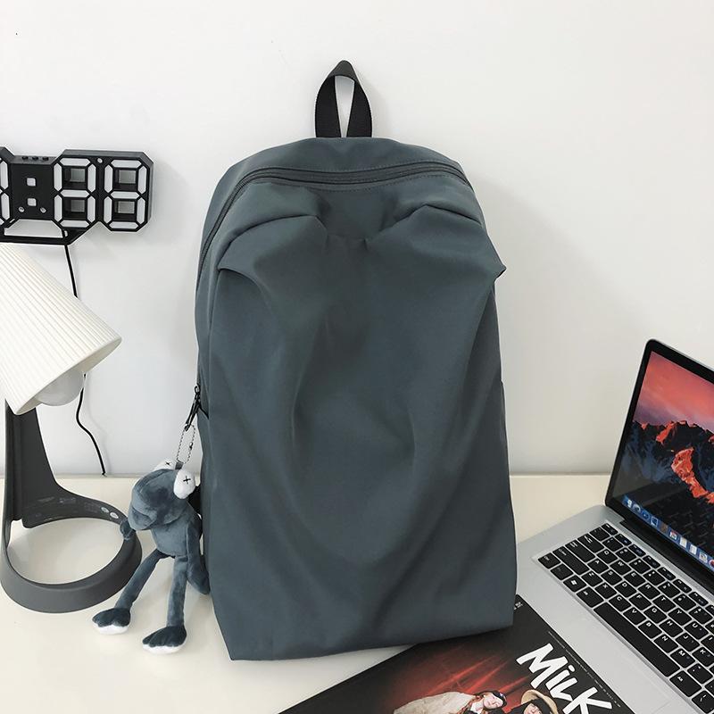 

Простий рюкзак. Шкільний ранець для молодших школярів для чоловіків і жінок. Корейська версія. Японський рюкзак для старшокласників. Without pendant сірий колір