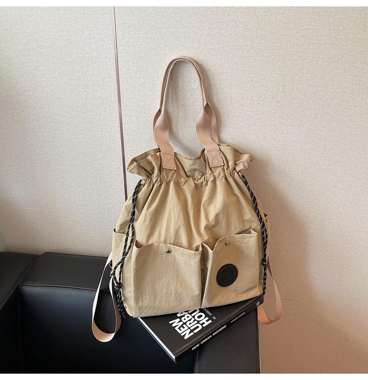 

Новая модная легкая сумка женская новая дорожная сумка на шнурке студенческий школьный рюкзак высококлассный повседневный наплечный рюкзак хаки