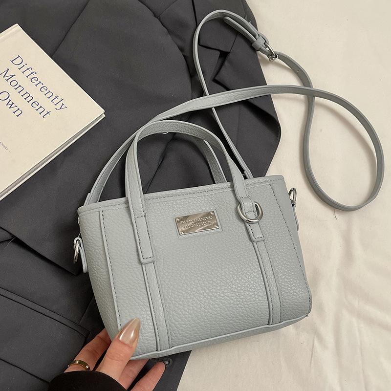 

Spring hot sale lychee pattern high-end portable bucket bag Korean version casual small fresh temperament versatile messenger women s bag