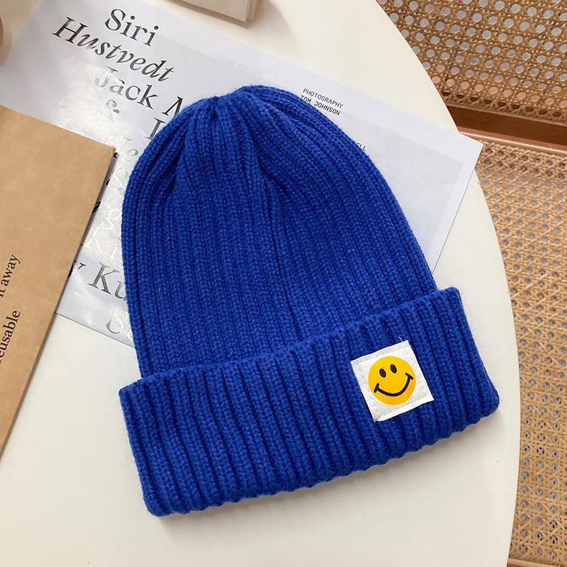 Smiley face label wool hat female autumn and winter warm bag head couple trendy brand cold hat solid color student male knitted hat