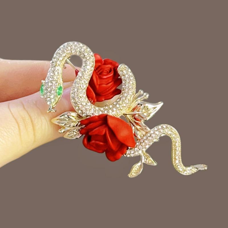 

Ретро Брошка-Змія Червоне Золото - Висококласна, Вишукана Брошка з Нотою Унікального Шарму та Блискучими Стразами.