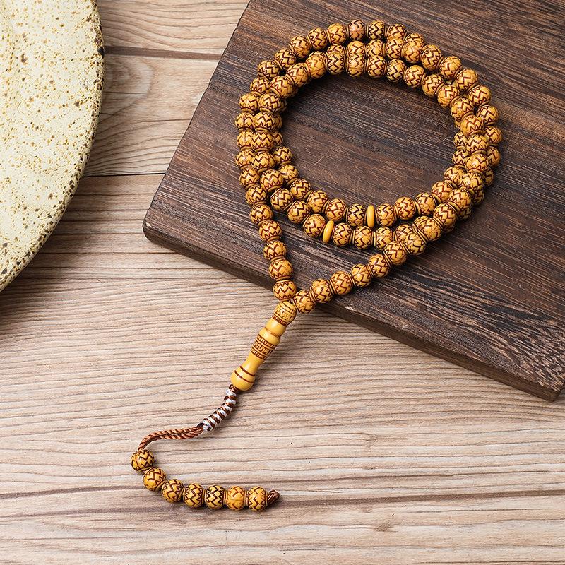 Ručně vyráběný 99-korálkový růženec Tasbih s imitací dřevěné kresby ze Saúdské Arábie