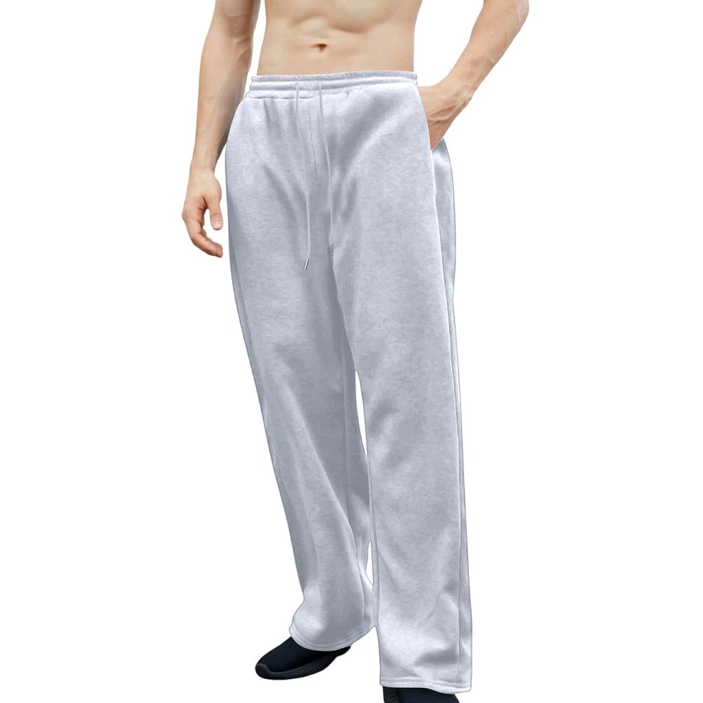 Pánské tepláky s elastickým pasem, rovný a široký střih, volný střih, s kapsami v pase.