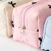 Kosmetiktasche mit Reißverschluss und Schleife, gesteppt, Puffer, süße Damen-Clutch