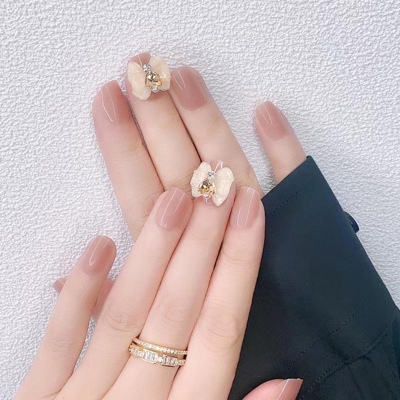 

Handmade Wearable Nude Bow Nail Art Tips - Short and Versatile Style Phototherapy Glue