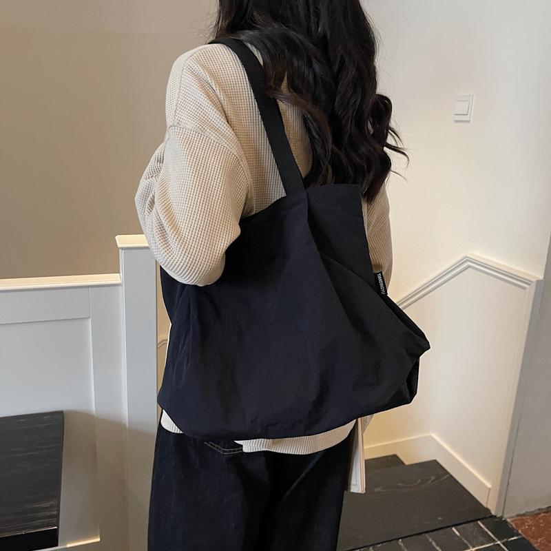 Minimalist Nylon Tote Bag with Spacious Design and Durable Handles Perfect for Everyday Use and Shopping