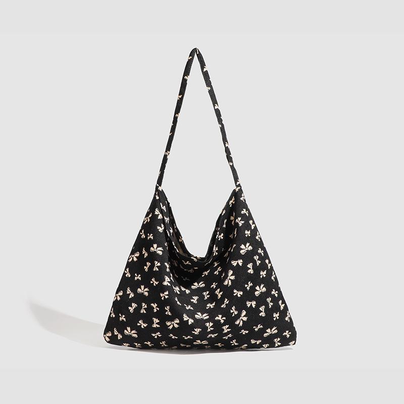 

Design sense niche canvas bag women s 2025 new large-capacity Korean leopard print floral shoulder student printed women s bag