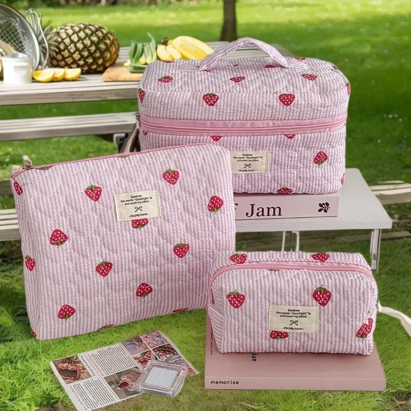 Zippered Cosmetic Pouch for Women, Portable Makeup Organizer in Unique Pink Strawberry Design, Travel-Ready Handbag