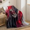 Red and black textured diagonal streaks with a central oval emblem. for all seasons blanket lunch break throw gift