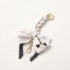 Elegant Hand-Woven Scarf Chain with Bow Decoration Pendant for Bag Strap Modification.