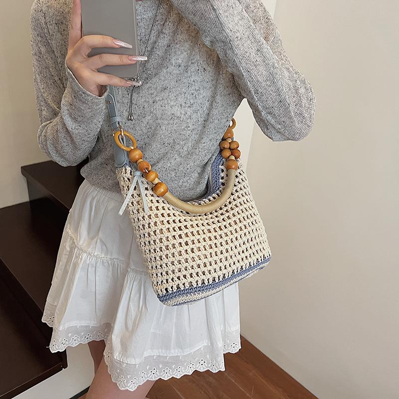 Holiday style woven bag women's 2025 new knitted hollow shoulder bag fashionable large-capacity messenger bag beach bag