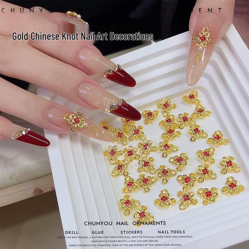 

Chinese Knot Gold Nail Art Jewelry with Red Diamond Rhinestones for New Year