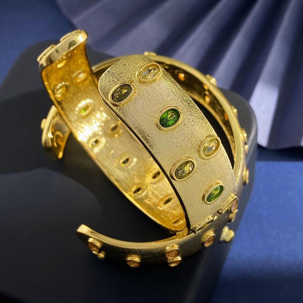 Brushed Gold-Plated C-Shaped Bracelet with Oval Gem