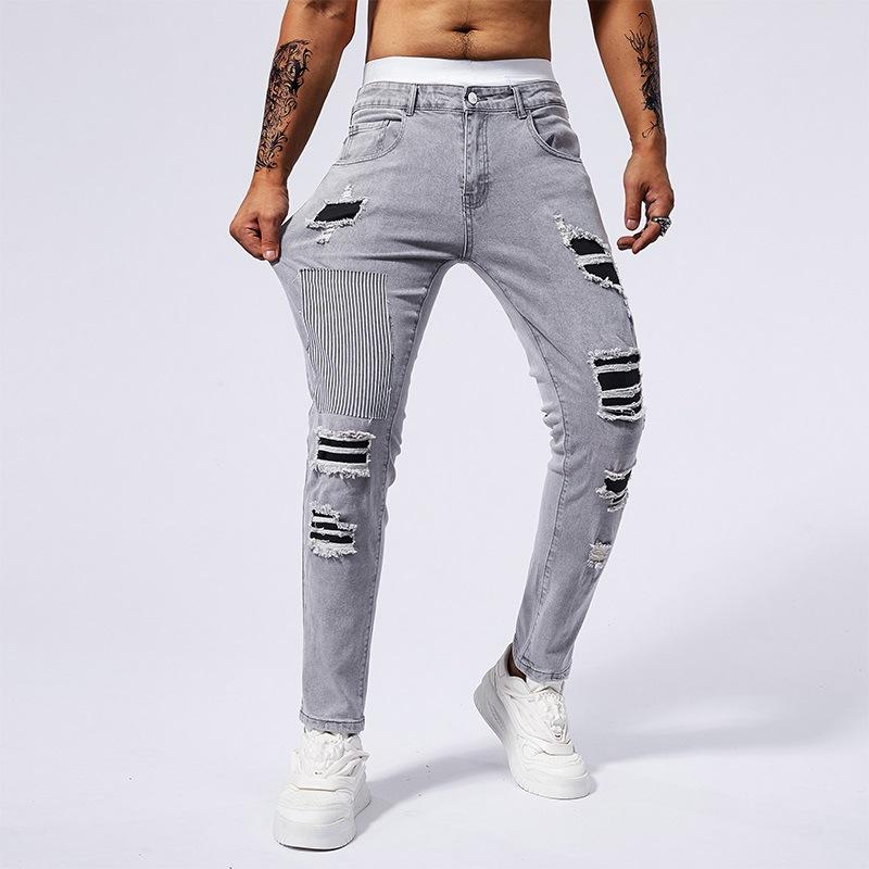 

Модные мужские джинсы из хлопка с вышивкой и рваным принтом 36 серый