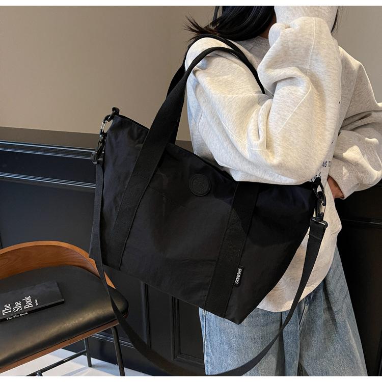 

Large capacity nylon commuter bag casual versatile shoulder messenger bag short trip business travel luggage bag class bag 42*14*27 чёрный