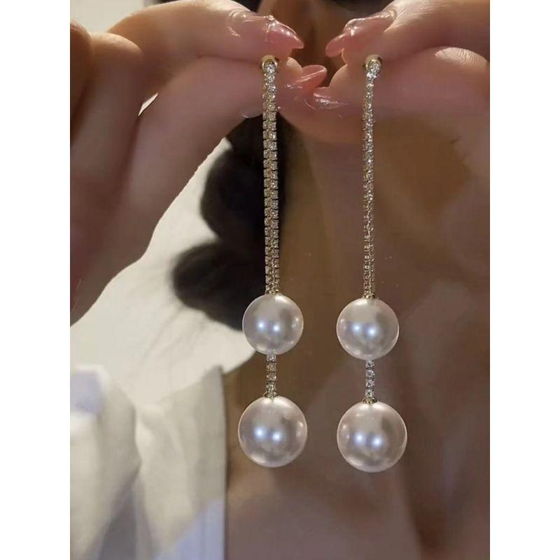 

Жемчужные бриллиантовые висячие серьги серьги-пусеты из стерлингового серебра интернет-знаменитость ношение спереди и сзади 2023 новое поступление самые продаваемые преувеличенные серьги White Pearl front and back wearing A1141